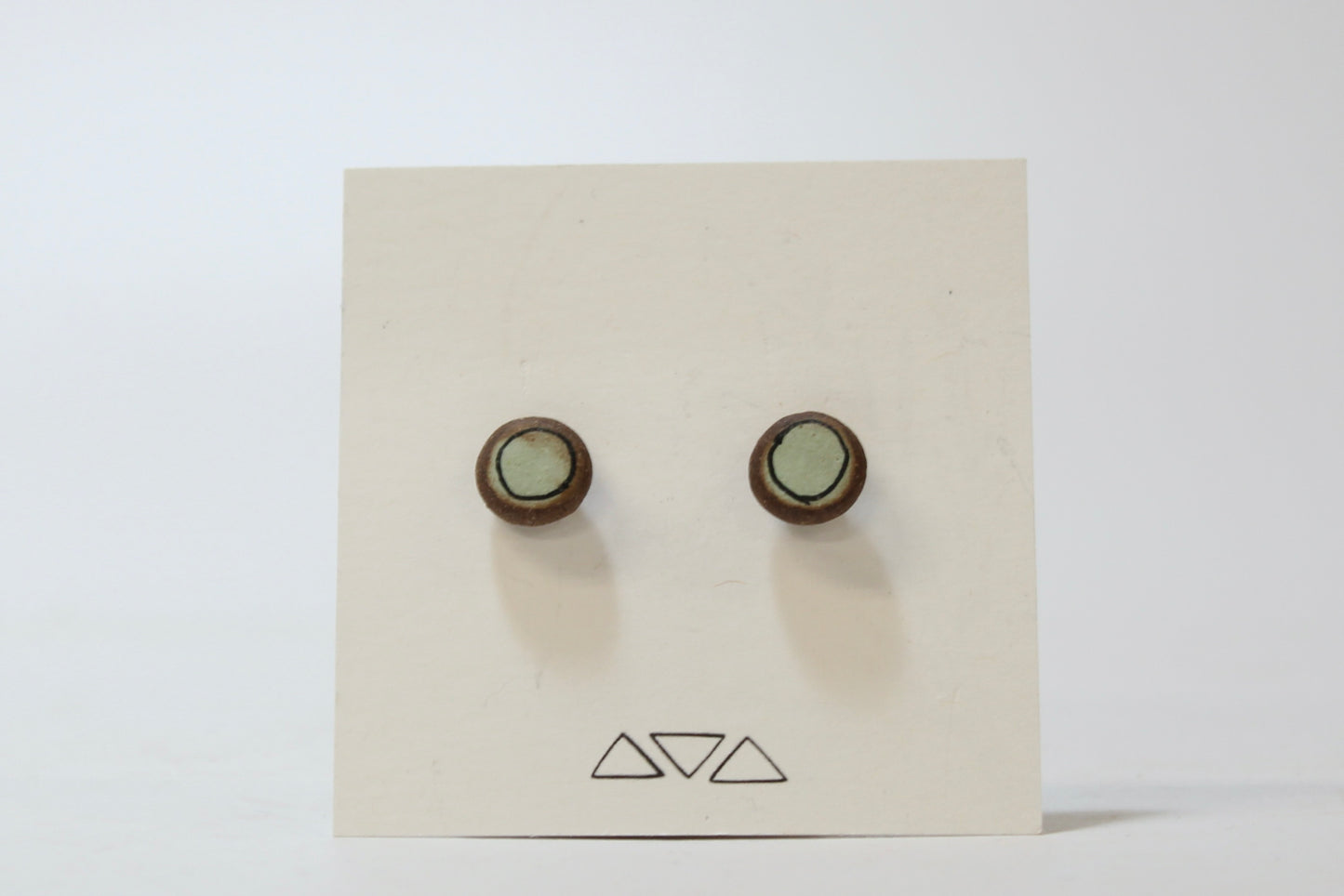 215. Light Teal Dot Stud Earrings. Stainless steel stud with stabilizer backs. 3/8"