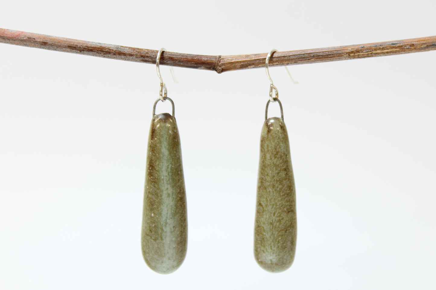 224. Dangly Earrings with Drippy Turquoise Glaze. 2" x 0.5"